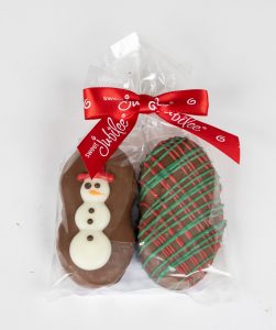 A holiday delight, hand decorated cookies in a gift bag with snowmen